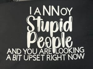 Unisex T-Shirt that has I Annoy Stupid People And You Are Looking A Bit Upset on the front